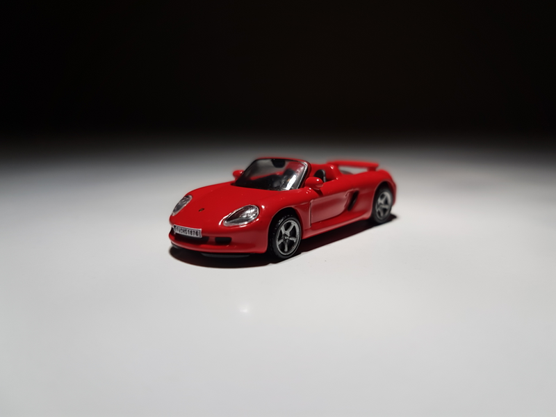 Illustration for article titled Makeitfit Monday: Rennsport Reunion Edition - Malibu International 1:87 Porsche Carrera GT